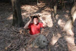 Climbing into Cu Chi Tunnel